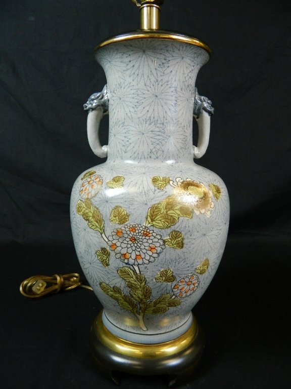Beautiful Turquoise, Blue, & Gold Japanese Lamp: A beautiful 35" Blue and Turquoise Japanese lamp in good condition. Very elegant floral design lined in gold. There is a small crack near the top of the lamp but it is barely noticeable. The lamp has 