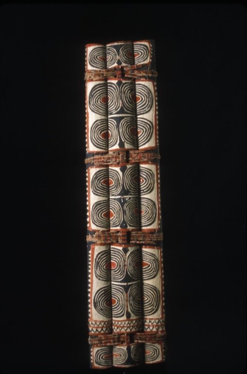 Papu New Guinea Ceremonial War Shield: #89 56" H x 13" W, Oswa Nuoto Ceremonial war shield with design in red and black. Kandrian Area.