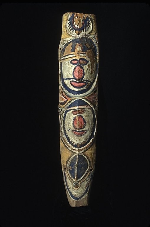 Papua New Guinea Abelam Commemorative Piece: #171 Abelam commemorative piece: Two faces carved and painted with other designs in black, red, and white on a light yellow background. Surface is cracked showing signs of aging, color is peeling in a