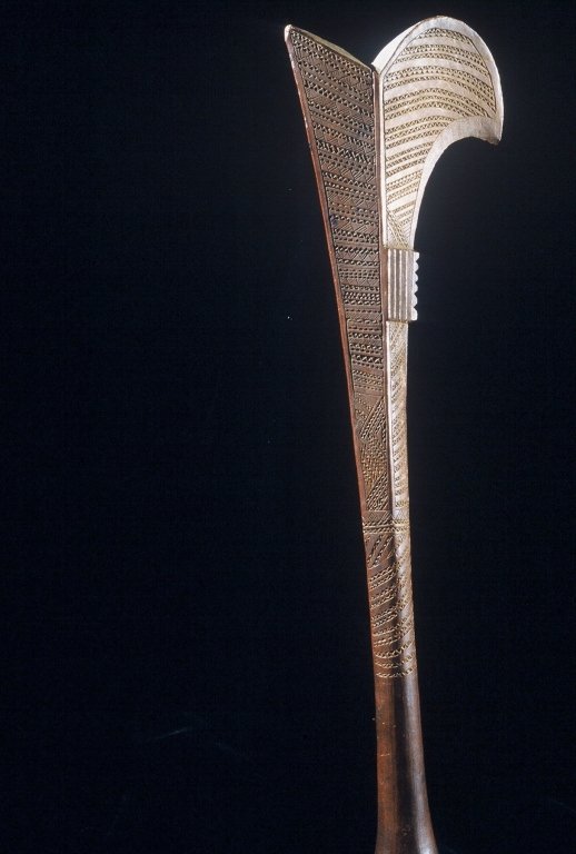 Papua New Guinea Fijian Club: #323 27" long club, dark brown patina incised with geometric patterns.