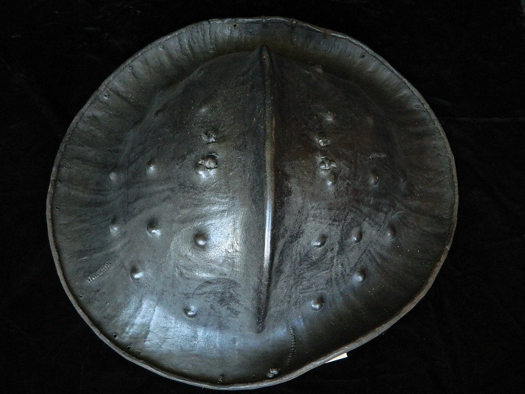 African Animal Hide War Shield from Ethiopia: This African war shield/ weapon from the 19th century originates from Ethiopia.The Oromo people made shields from the Hippopotamus hide and or some times Rhinoceros hide. Approximately 25" long and 23