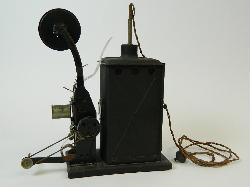 Moviegraph Hand Cranked 35 mm Toy-like Projector: Up for auction is a Moviegraph Bing Hand Cranked 35 mm Projector. This projector is From around 1919.