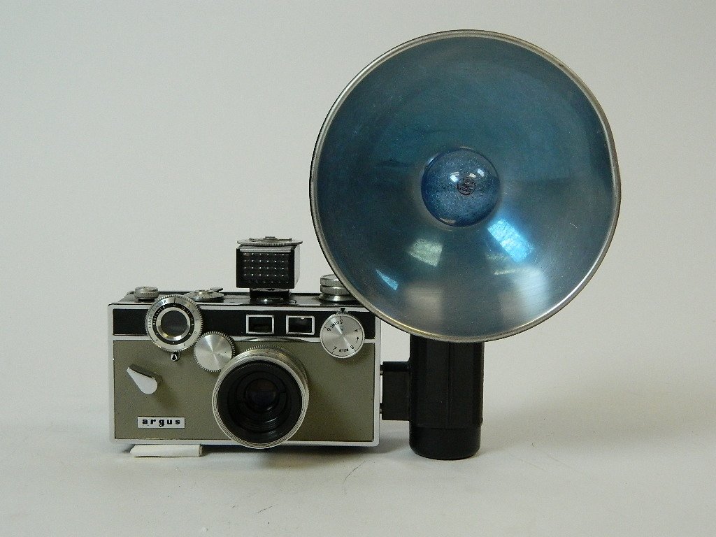 Vintage Argus C-3 Matchmatic Camera w/ Flash: Argus C-3 Matchmatic Camera with flash and meter 50. This has a Black & Almond color and comes with original manuals. Circa 1958-1966