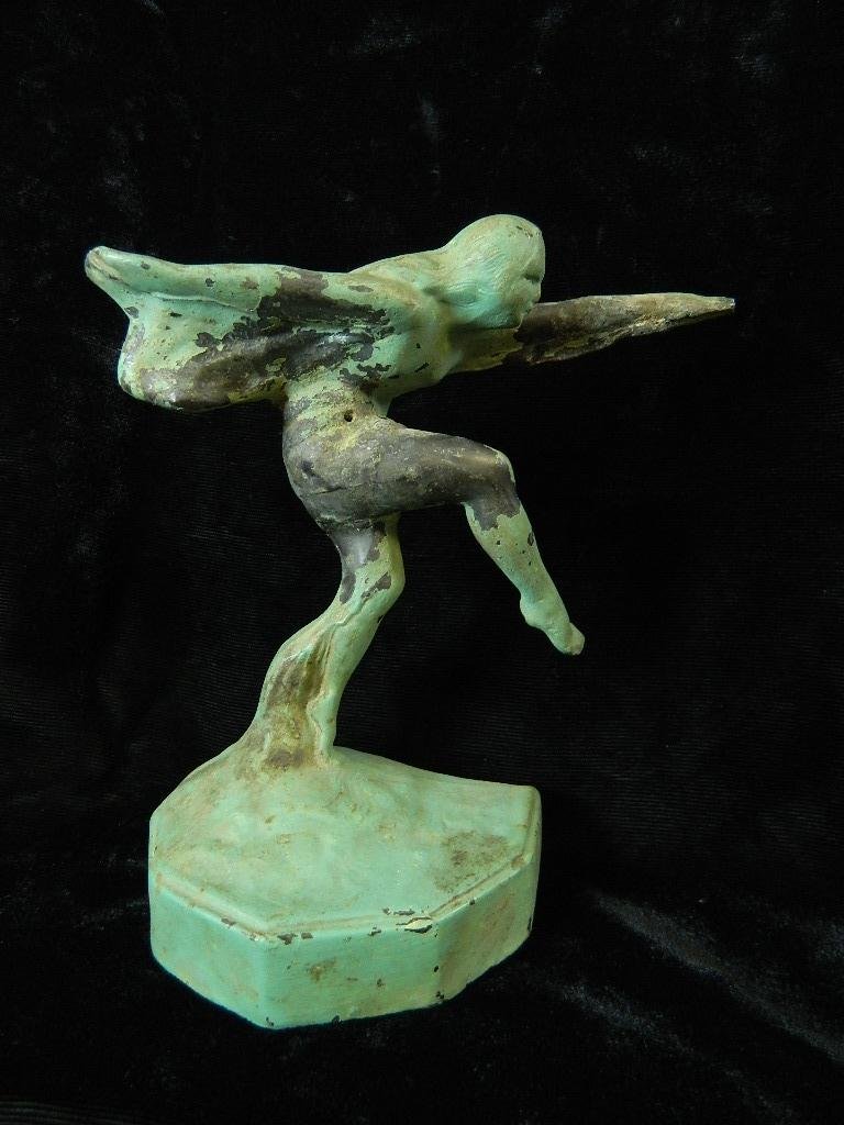 Cast Iron dancing flapper woman circa 1930 Frankart?: Up for auction we have a cast iron figurine of a woman standing on one leg with one arm outstretched in front of her and one behind her. There is paint rubbed off in some areas. It is 6 1/4 " tall and