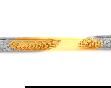 22K Gold Bracelet: 22K Gold Braceletthe bangle bracelet featuring applied yellow gold bead design; numbered KDM56; 10.26 dwts.; int. cir. 6 3/4 in.