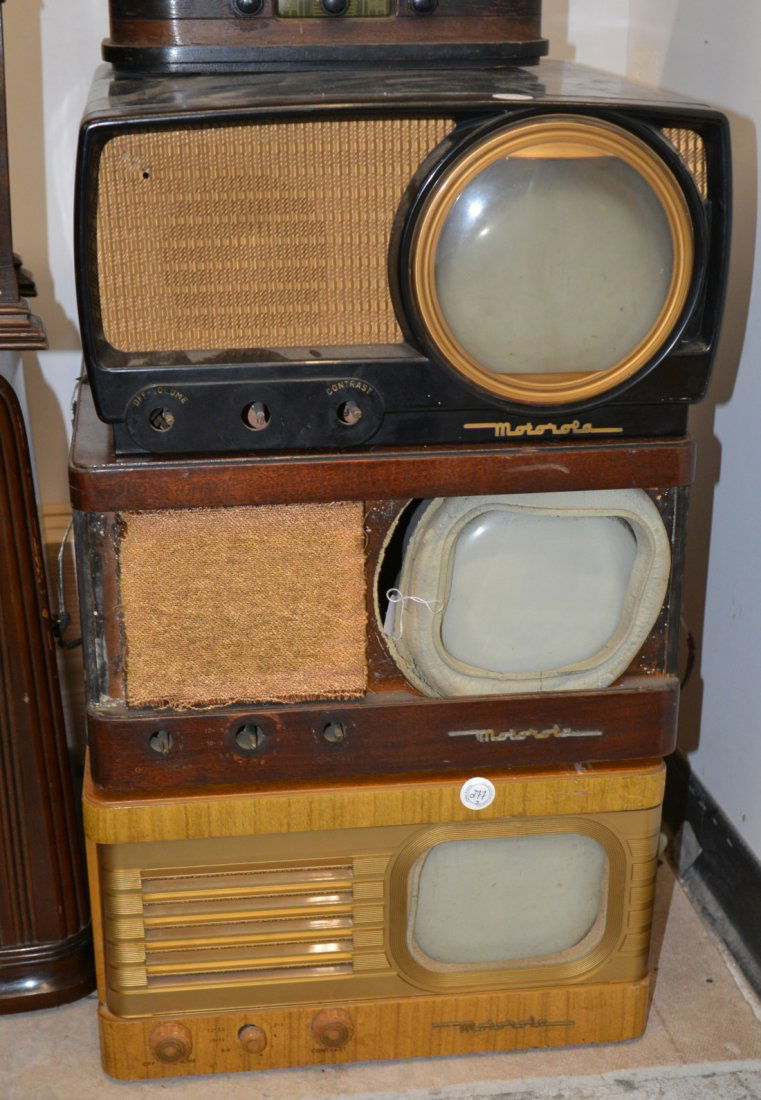 THREE MOTOROLA TABLE MODEL TELEVISIONS; including: one: THREE MOTOROLA TABLE MODEL TELEVISIONS; including: one bakelite with 7 inch screen, one blonde mahogany with 6 inch screen and one mahogany with 6 inch screen