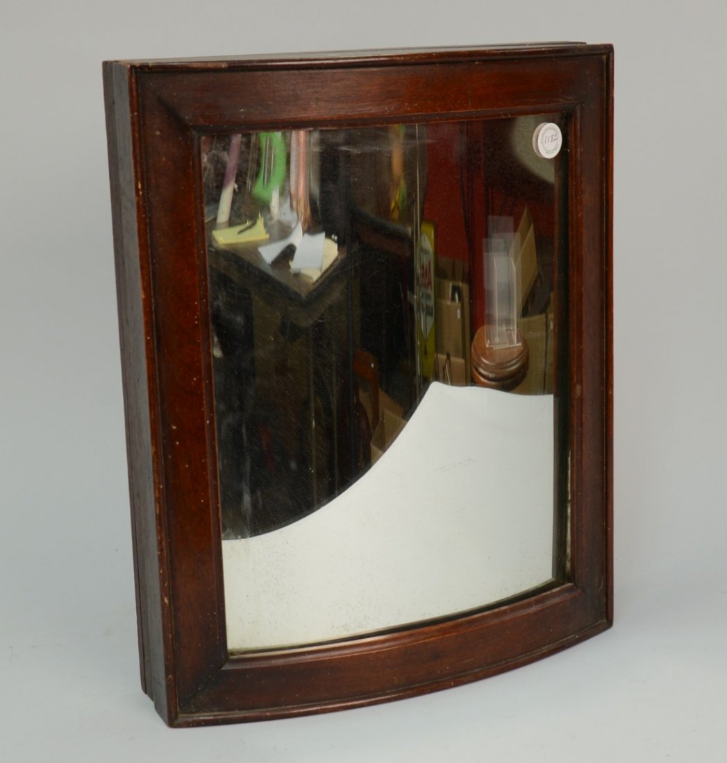 CONVEX MIRROR, in swiveling mahogany frame; 18 1/4 x 15: CONVEX MIRROR, in swiveling mahogany frame; 18 1/4 x 15 1/2 inches