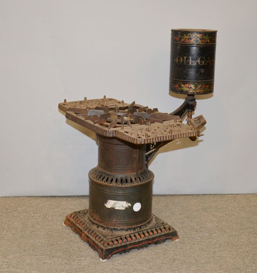 VICTORIAN CAST IRON AND TIN CAMP STOVE, with original s: VICTORIAN CAST IRON AND TIN CAMP STOVE, with original stencil decoration; height: 23 inches; width: 18 inches