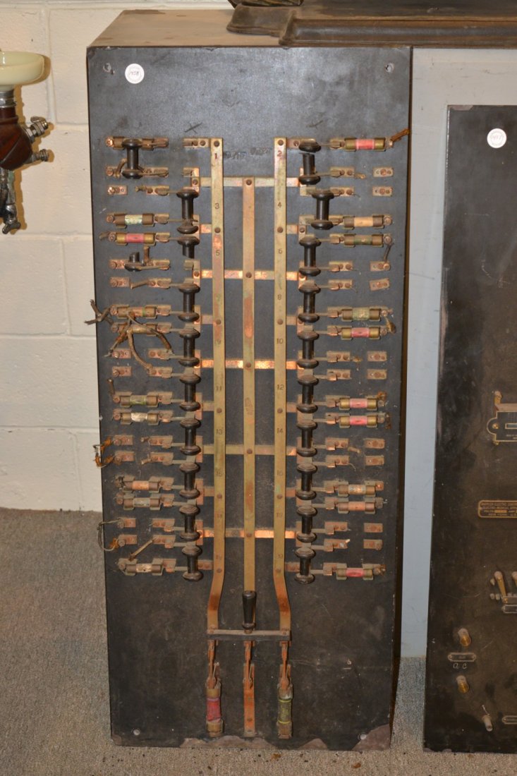 LARGE CIRCUIT BREAKER BOARD: LARGE CIRCUIT BREAKER BOARD, comprising brass throw switches marked Metropolitan Electric Manufacturing Co., mounted on slate plate; 42 x 17 inches