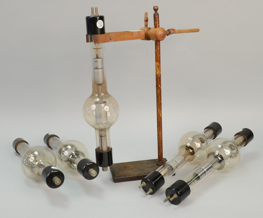 FIVE GENERAL ELECTRIC COOLIDGE X-RAY TUBES, no. KR3; le: FIVE GENERAL ELECTRIC COOLIDGE X-RAY TUBES, no. KR3; length: 21 inches; together with a WOOD LABORATORY STAND