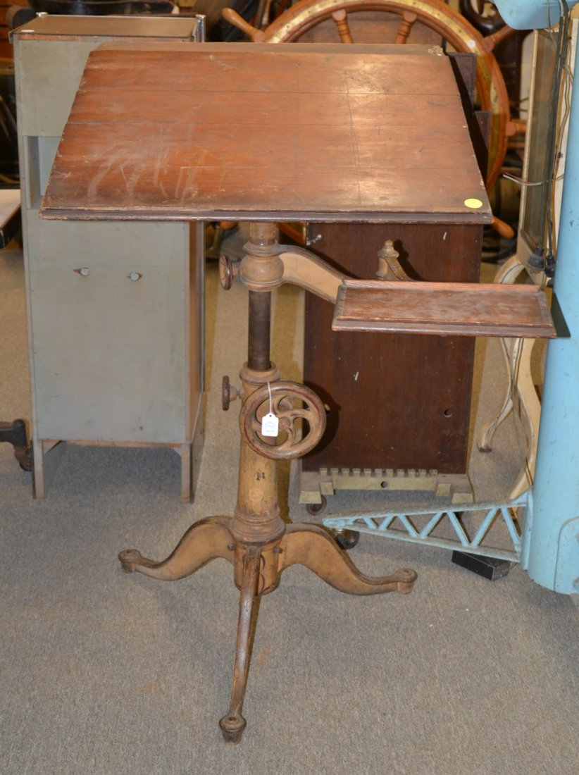CAST IRON ADJUSTABLE TILT TOP ARCHITECT STAND: CAST IRON ADJUSTABLE TILT TOP ARCHITECT STAND, circa 1880, with swing arm; height: 42 inches