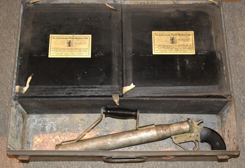SCHERMULY PISTOL ROCKET APPARATUS: SCHERMULY PISTOL ROCKET APPARATUS, size No. 2, 1908, in metal case; with two cases of 250 total feet of line, serial no. 11738; ""entirely British""; 26 x18 inches