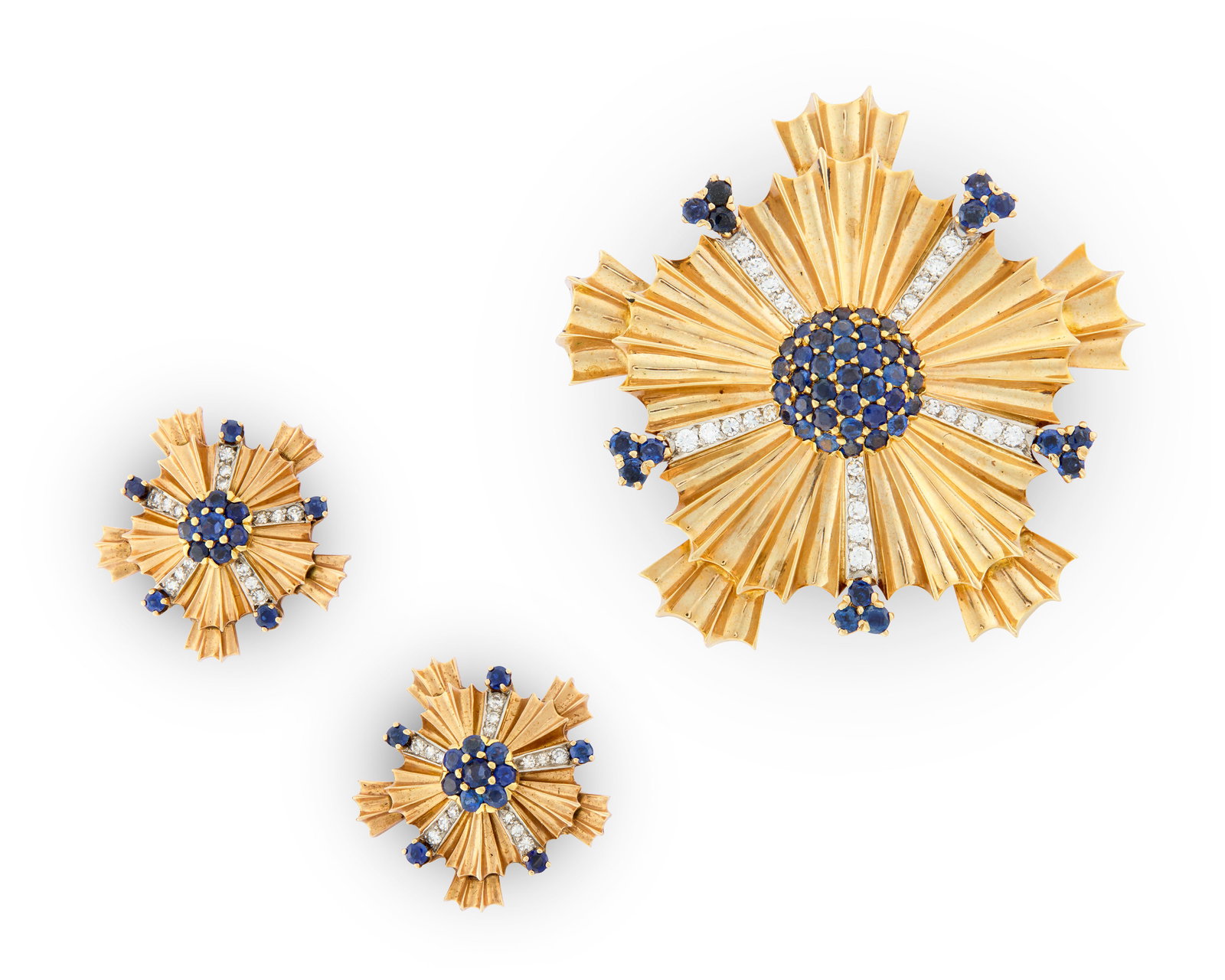 TIFFANY & CO. 14K Gold, Sapphire, and Diamond Suite: TIFFANY & CO. 14K Gold, Sapphire, and Diamond Suite Retro; comprising a brooch and earclips; the fluted starburst brooch centering a cluster of 36 circle-cut sapphires framed by five graduated rows