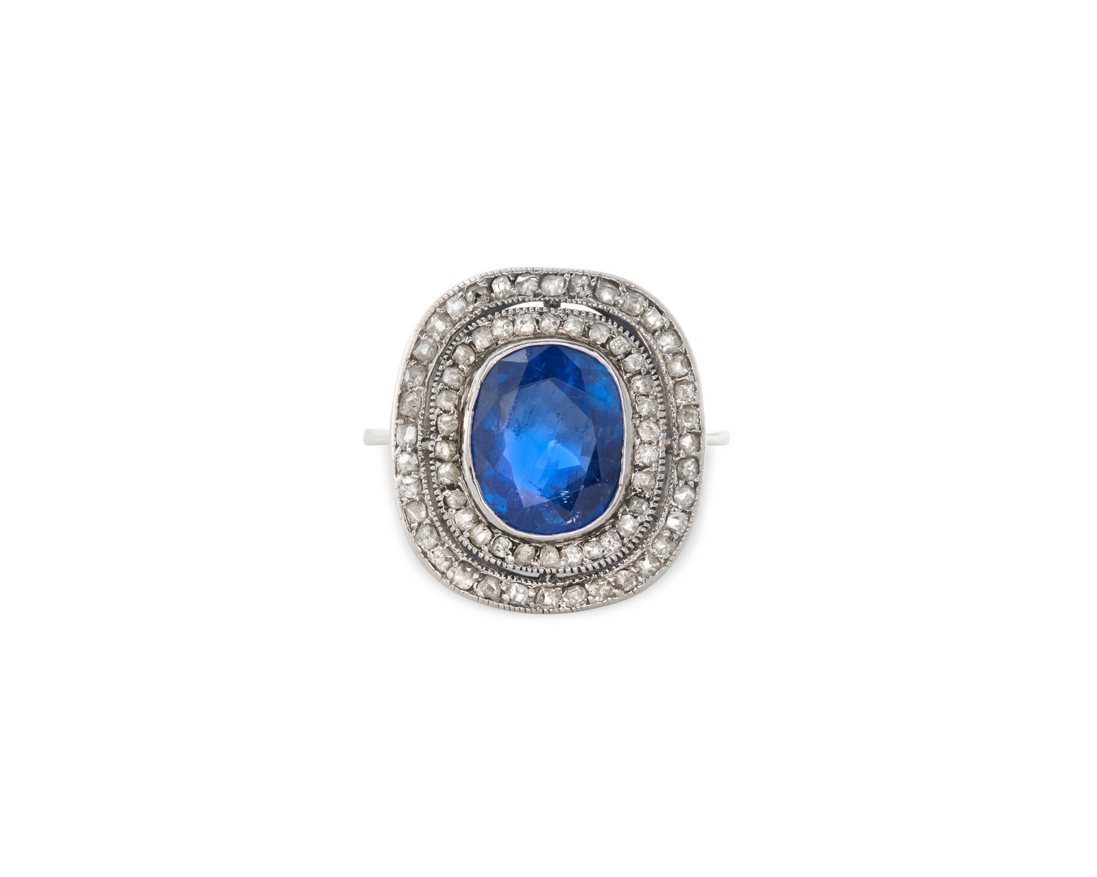 Platinum, Burmese Sapphire, and Diamond Ring: Platinum, Burmese Sapphire, and Diamond Ring centering an oval-cut sapphire weighing approx. 3.40 cts. framed by two rows of bead-set single-cut diamonds weighing approx. 0.46 tcw.; 3.35 dwts.; size
