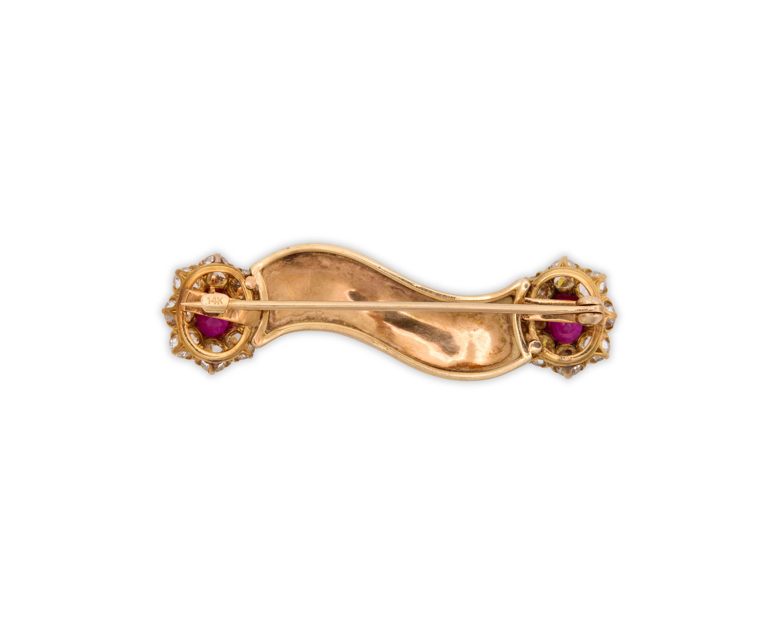 14K Gold, Ruby, and Diamond Brooch: 14K Gold, Ruby, and Diamond Brooch featuring a polished yellow gold curved plaque framed on either side with prong-set oval-cut rubies encircled by old mine-cut diamonds; rubies weighing approx. 1.40