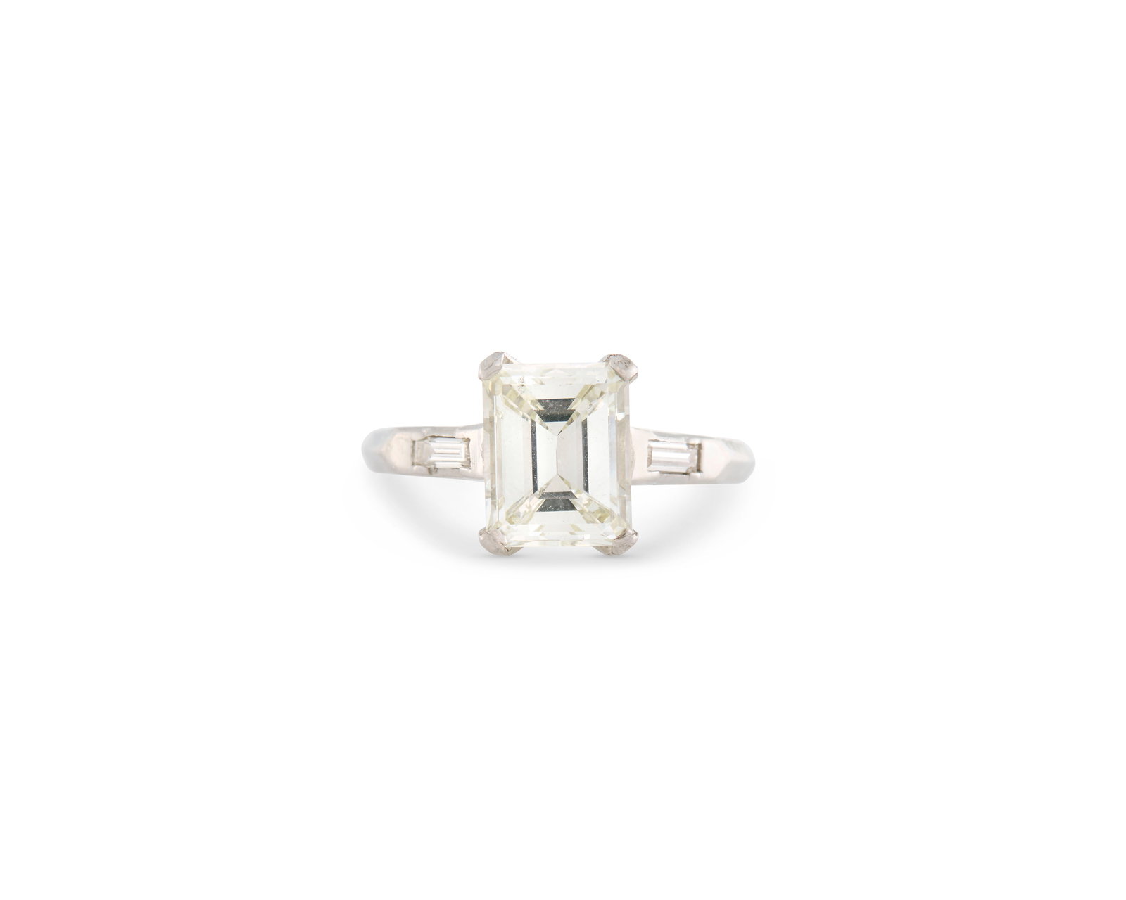 Platinum and Diamond Ring: Platinum and Diamond Ringcentering a prong-set emerald-cut diamond weighing 2.11 cts. flanked by two baguette-cut diamonds; 2.81 dwts.; size 6 3/4Accompanied by GIA report no. 1232874819 dated Februar