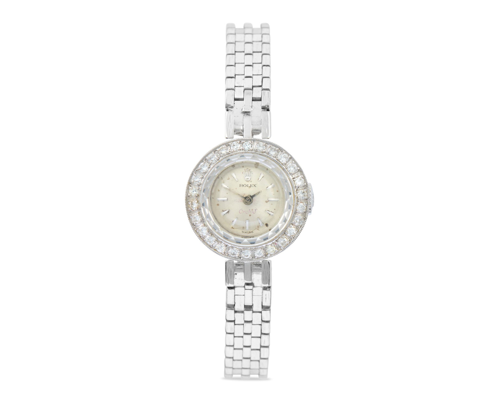 ROLEX 10K Gold and Diamond Wristwatch: ROLEX 10K Gold and Diamond Wristwatchthe round silver-toned dial with applied baton numeral indicators; enclosing a manual-wind movement; signed on dial and case back; bezel bead-set with full-cut dia