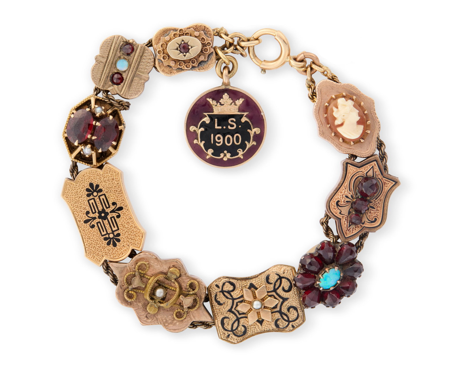 Antique Gold, Gemset, and Enamel Charm Bracelet: Antique Gold, Gemset, and Enamel Charm Braceletfeaturing shield-form links set with black enamel, seed pearls, opals, garnets, and colored glass completed by a red and black enameled charm; 21.23 dwts