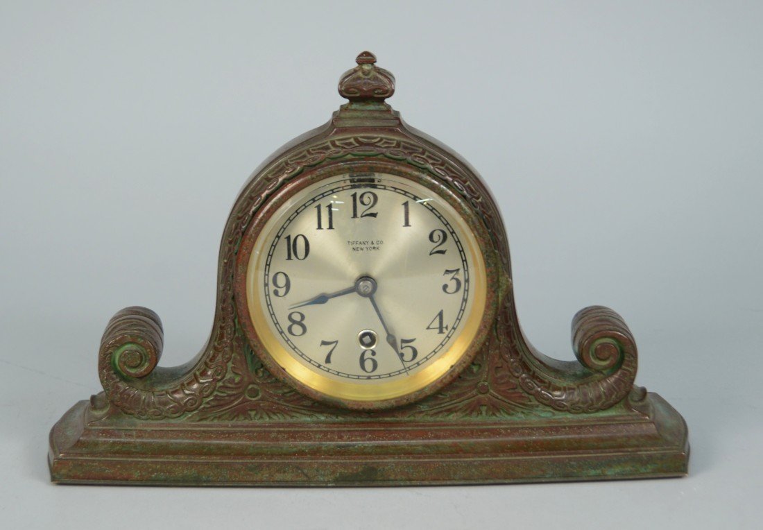 TIFFANY STUDIOS PATINATED BRONZE MANTLE CLOCK;: TIFFANY STUDIOS PATINATED BRONZE MANTLE CLOCK; the dial inscribed Tiffany & Co., New York; the base inscribed Tiffany Studios, New York, 2073; the clock works marked Chelsea Clock Co., Boston, U.s.a.;