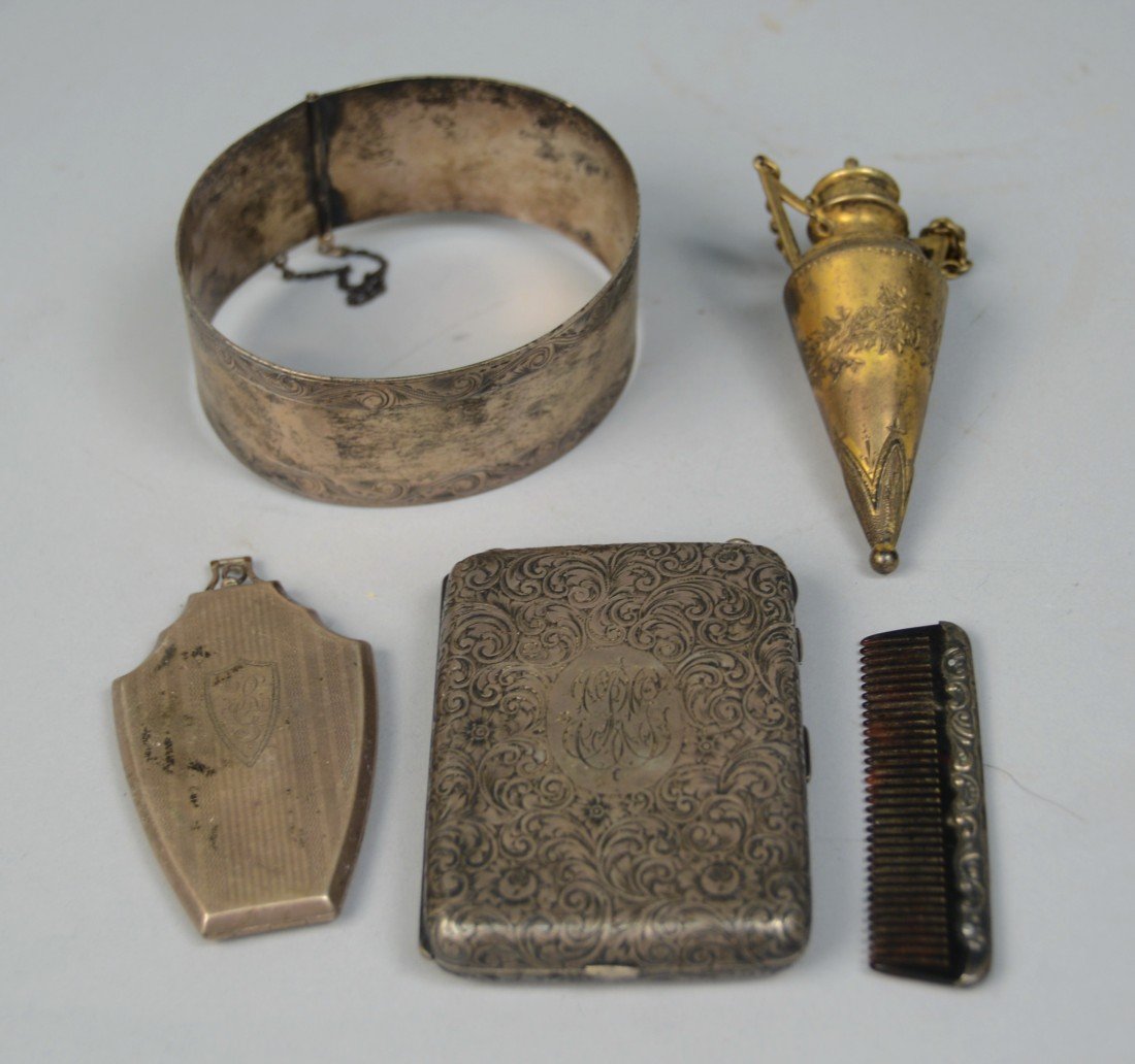 VICTORIAN CHASED SILVER AND GILT SILVER CIGARETTE COMPA: VICTORIAN CHASED SILVER AND GILT SILVER CIGARETTE COMPACT CASE; 3 1/2 x 2 1/2 inches, weight: 6.2 ozs.; together with a silver cuff bracelet, a silver and tortoise shell comb, a compact case, and a gi