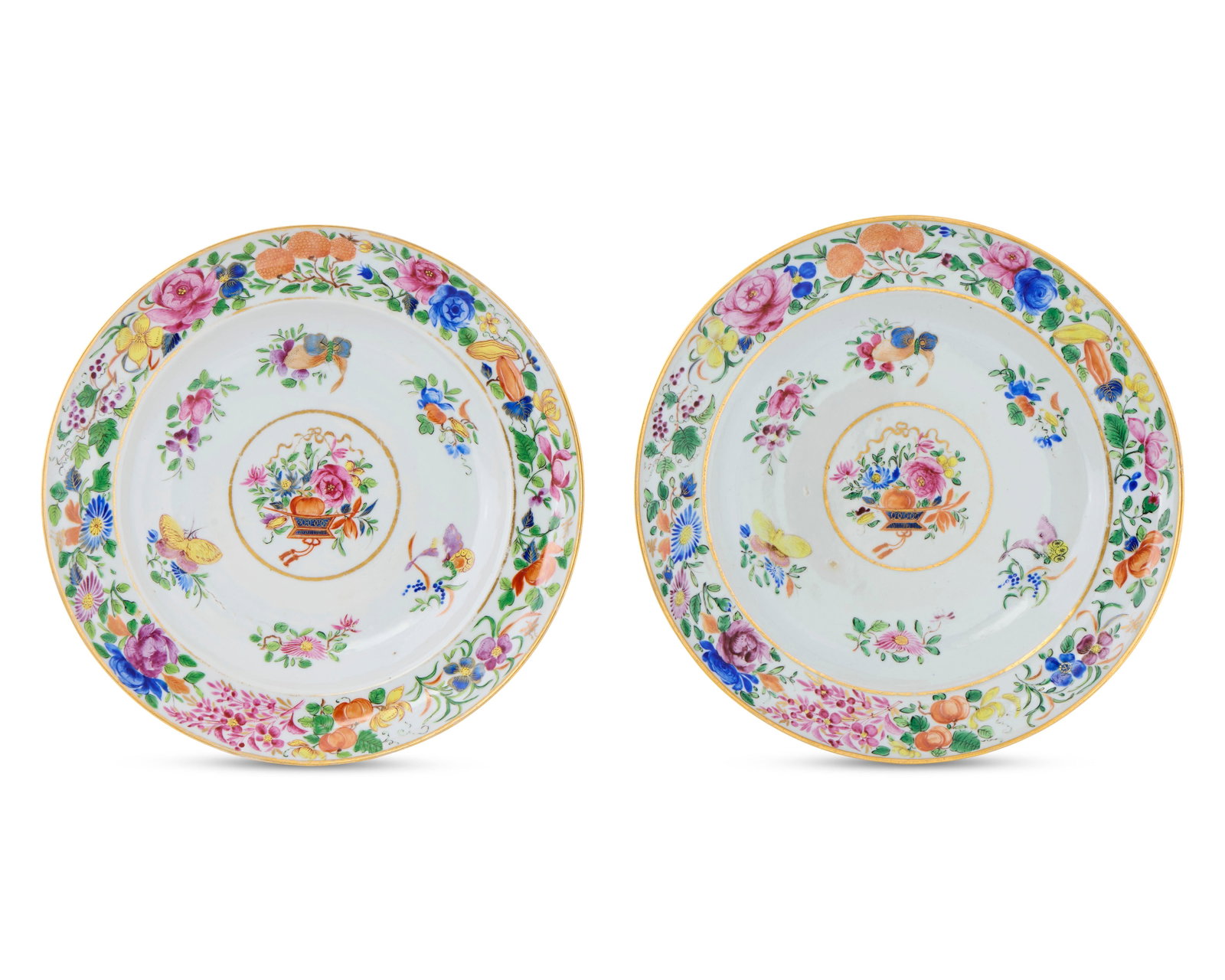 Pair of Chinese Export Famille Rose Plates: Pair of Chinese Export Famille Rose Plates ca. 1840-1850; depicting in the central roundel a floral spray; decorated with gilt rim and a polychrome border of flowers, fruits, and gourds; diameter: 9 3