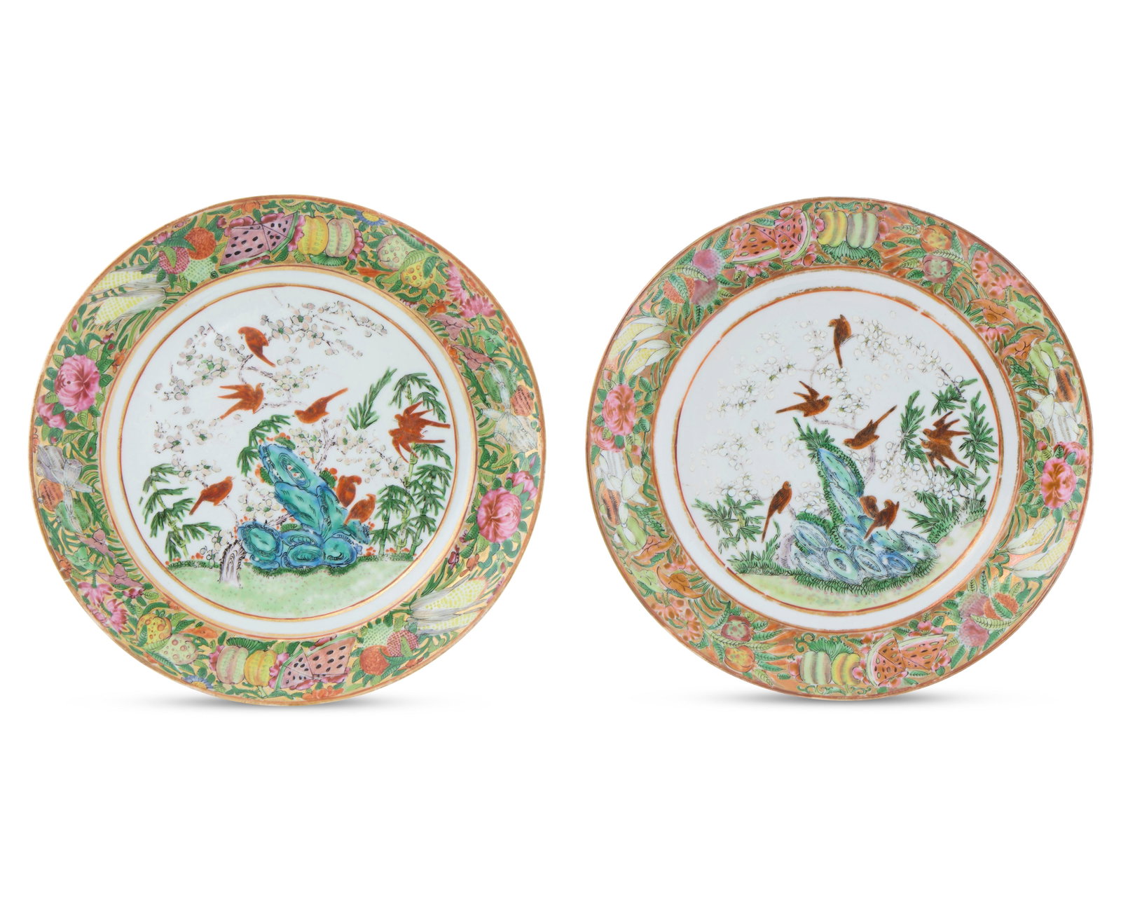 Pair of Unusual Chinese Export Canton Famille Rose Plates with American Fruits in the Border: Pair of Unusual Chinese Export Canton Famille Rose Plates with American Fruits in the Border ca. 1830-40; depicting birds resting on a flowering branch above a rock and decorated with a polychrome bor