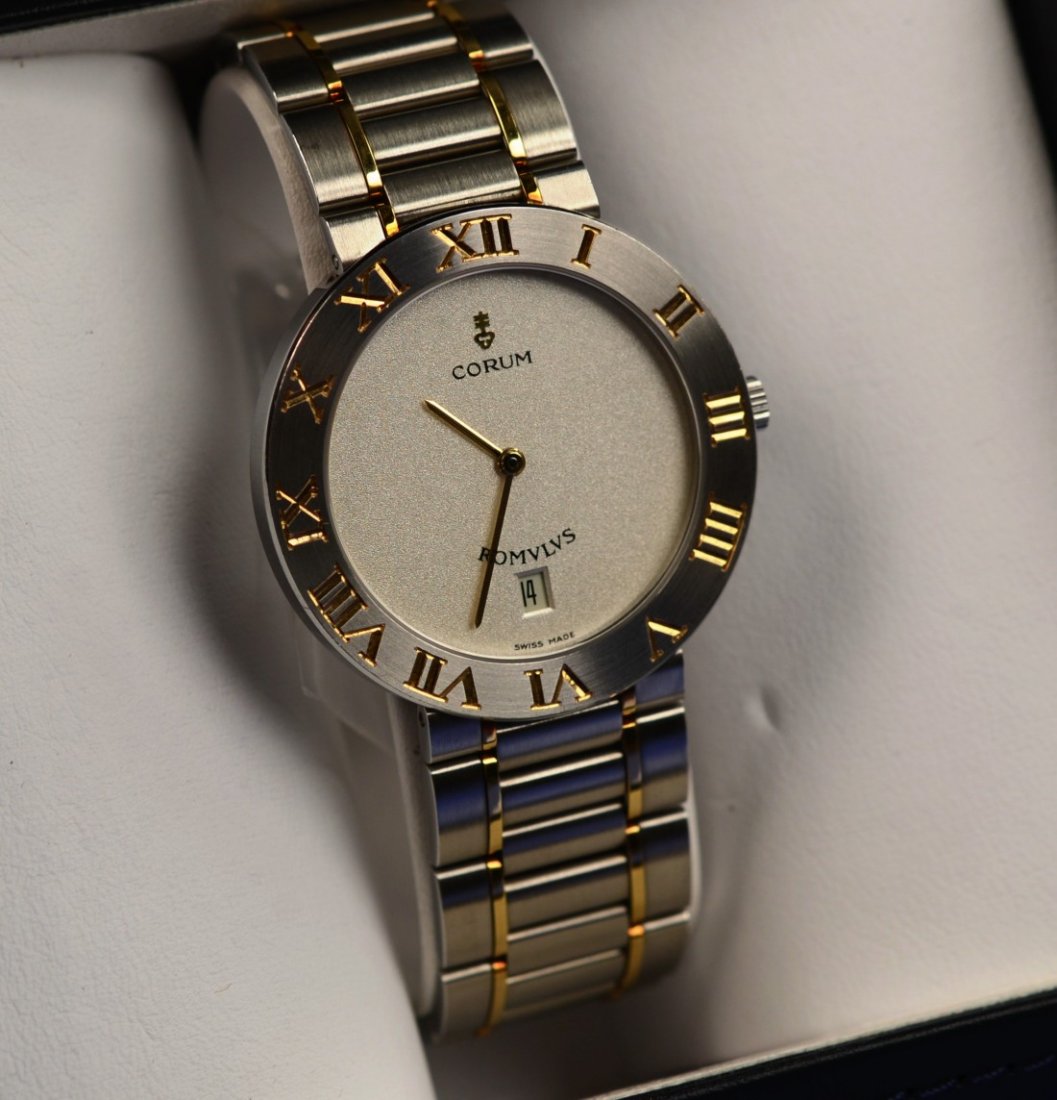 18K YELLOW GOLD AND STAINLESS STEEL ROMULUS WATCH,: 18K YELLOW GOLD AND STAINLESS STEEL ROMULUS WATCH, Corum model #43 70321 V400 #594814; in original Corum box with papers