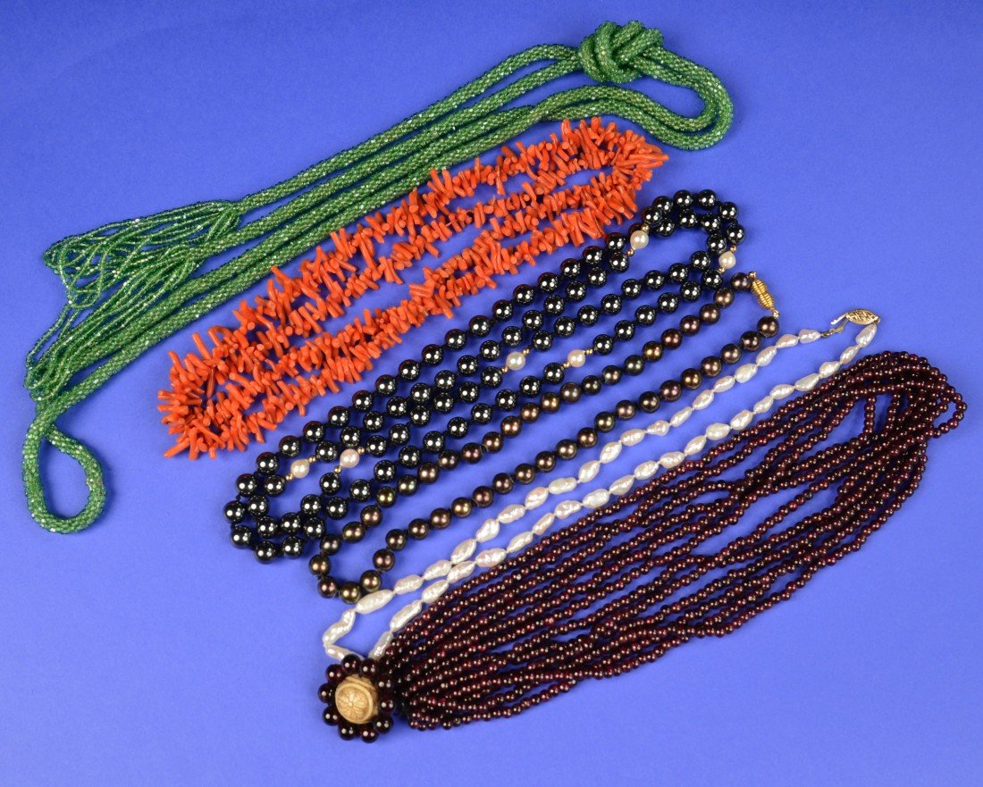 COLLECTION OF SIX BEADED NECKLACES: COLLECTION OF SIX BEADED NECKLACES including red coral, black pearl, freshwater pearl, purple glass with carved ivory clasp, hematite, and green glass seed bead braided sautoir