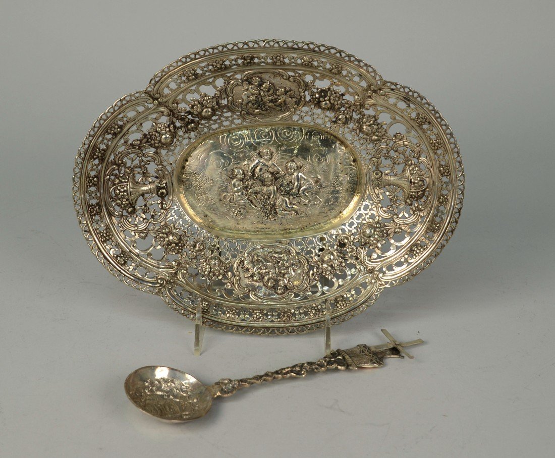 GERMAN SILVER RETICULATED OVAL BASKET;: GERMAN SILVER RETICULATED OVAL BASKET; length: 11 inches, weight: 10 ozs.; together with a DUTCH SILVER SPOON, length: 8 1/2 inches, weight: 2 ozs.; and a CONTINENTAL COVERED CHALICE, height: 10 inche