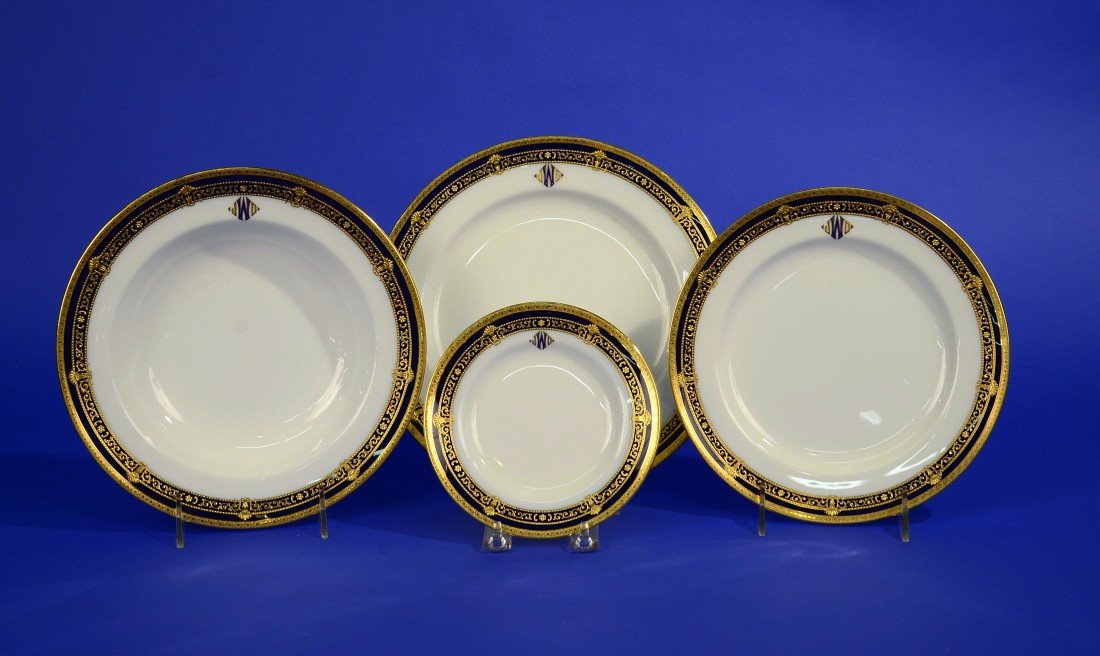 LARGE SERVICE OF MINTON PORCELAIN GILT AND COBALT: LARGE SERVICE OF MINTON PORCELAIN GILT AND COBALT DECORATED PLATES, retailed by Davis Collamore & Co., Ltd., New York; monogrammed: JWD; including: 15 dinner plates, diameter: 10 1/4 inches; 23 lunche