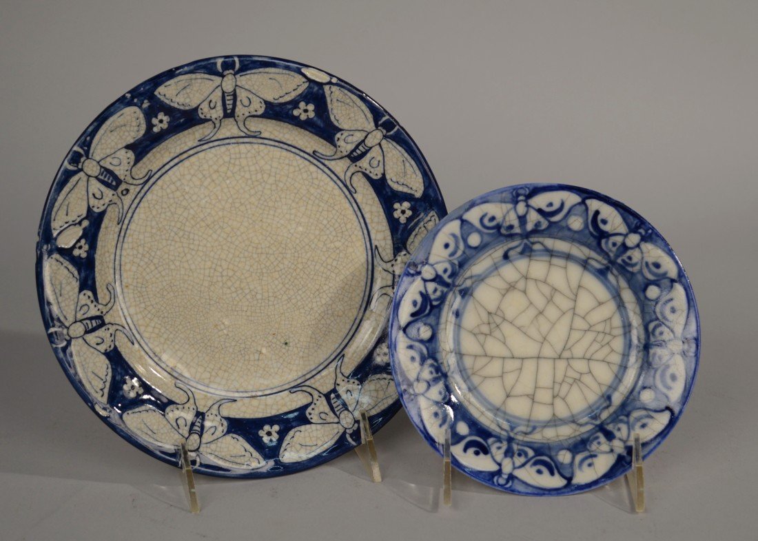 TWO DEDHAM POTTERY PLATES;: TWO DEDHAM POTTERY PLATES; one moth pattern, with blue Dedham Pottery stamp, diameter: 6 inches; and one butterfly with flower pattern, with impressed foreshortened rabbit mark, diameter: 8 1/2 inches