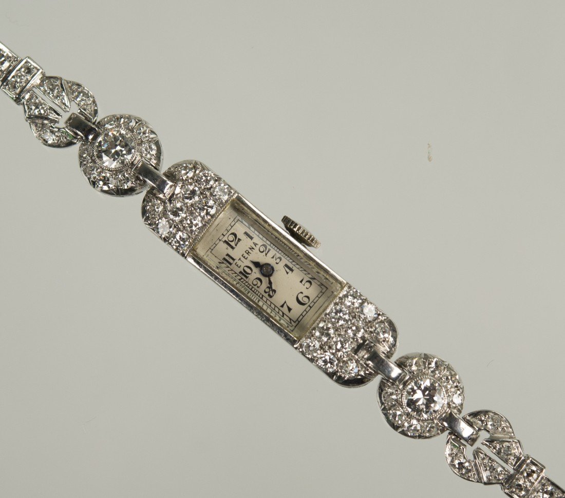 PLATINUM AND DIAMOND LADY'S WRISTWATCH, Eterna: set with circle-cut diamonds weighing approx. 1.45 cts. total; weight sans movement 11.18 dwts.; length 6 3/4 in.