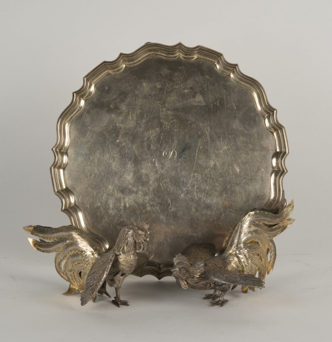 PAIR OF SOUTH AMERICAN SILVER TABLE BIRDS: PAIR OF SOUTH AMERICAN SILVER TABLE BIRDS length: 6 3/4 in., weight: 17 ozs.; together with an ENGLISH SILVER TRAY, London, 1924, diameter: 10 in., weight: 38 ozs.