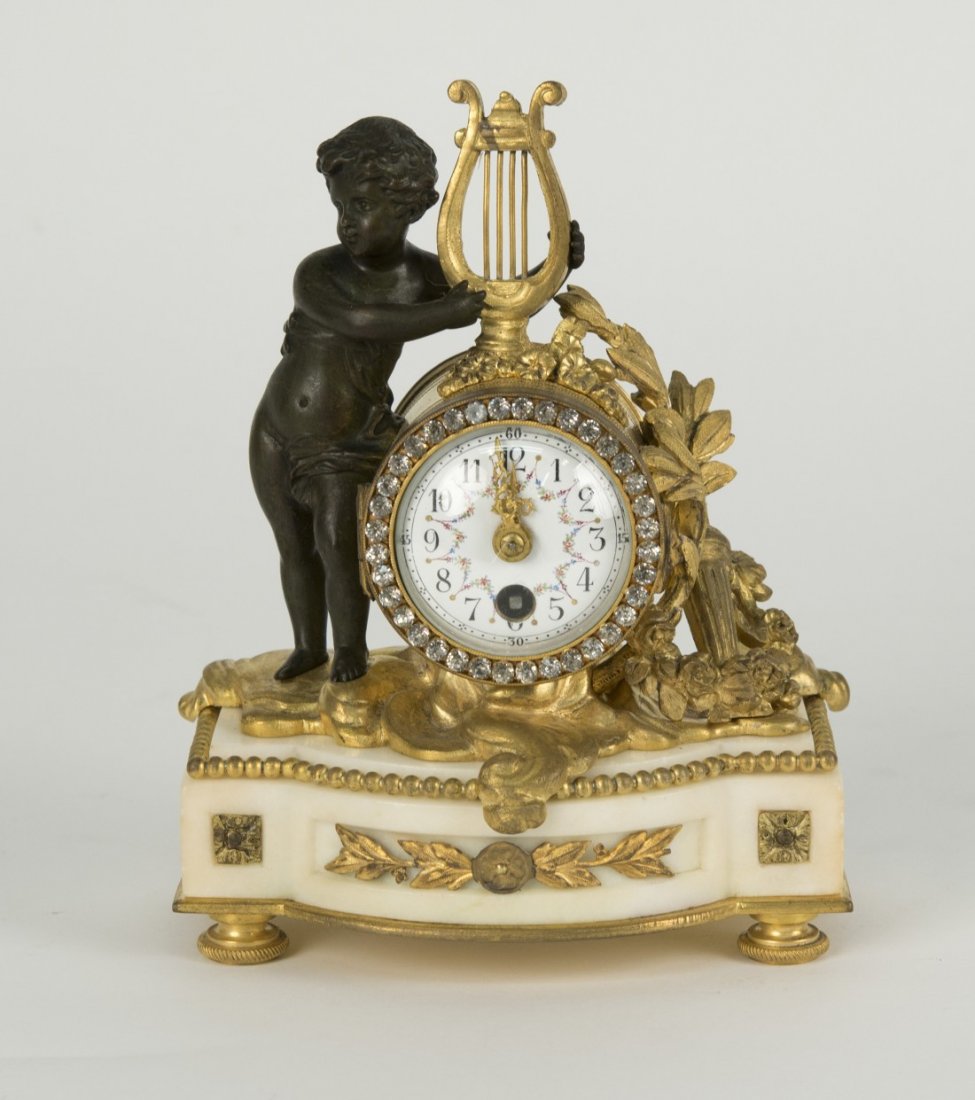 LOUIS XVI STYLE GILT AND PATINATED BRONZE AND MARBLE: LOUIS XVI STYLE GILT AND PATINATED BRONZE AND MARBLE DESK CLOCK; height: 7 in.