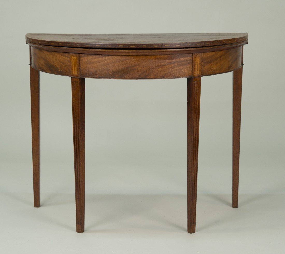 FEDERAL MAHOGANY INLAID DEMILUNE GAMES TABLE, early: FEDERAL MAHOGANY INLAID DEMILUNE GAMES TABLE, early 19th century; inscribed in chalk on base: Abigail Wordman, Brighton; height: 29 in.; length: 36 in.; depth: 18 in.