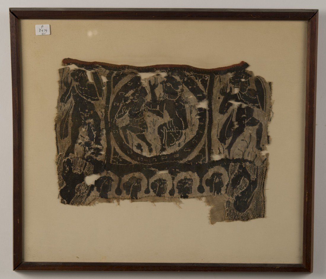 COPTIC TEXTILE FRAGMENT, 5th-7th century;: COPTIC TEXTILE FRAGMENT, 5th-7th century; depicting dancing figures, warriors, a lion and a hare; textile: 13 x 9 in. (18 1/2 x 16 in.) Provenance: Jacques Schulman, Amsterdam, 1964; Property of a New