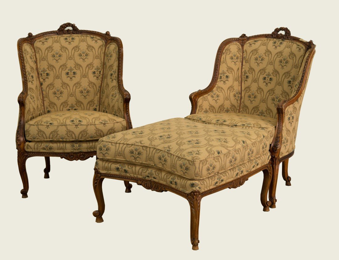 LOUIS XV STYLE THREE PIECE LONGUE;: LOUIS XV STYLE CARVED WLANUT THREE PIECE CHAISE LONGUE; comprising of a pair of bergeres and an ottoman; chair height: 40 in., width: 27 in., depth: 21 in.; ottoman height: 19 in., width: 28 in., dept