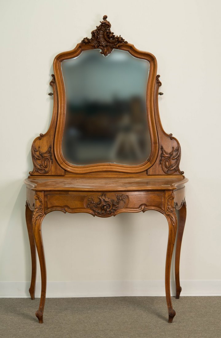 LOUIS XV STYLE CARVED WALNUT DRESSING TABLE;: LOUIS XV STYLE CARVED WALNUT DRESSING TABLE; with swivel mirror; height: 70 in., width: 40 in., depth: 22 in.