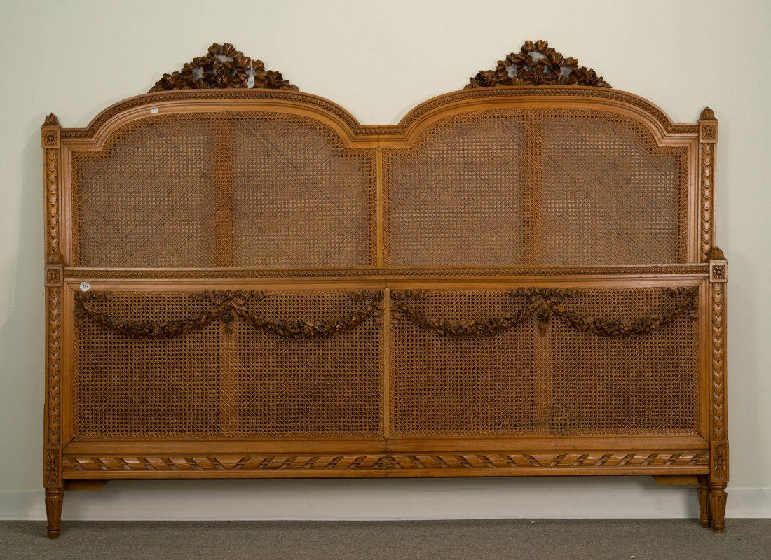 FRENCH CARVED FRUITWOOD AND CANED KING SIZE BED;: FRENCH CARVED FRUITWOOD AND CANED KING SIZE BED; height: 66 in., width: 87 in.