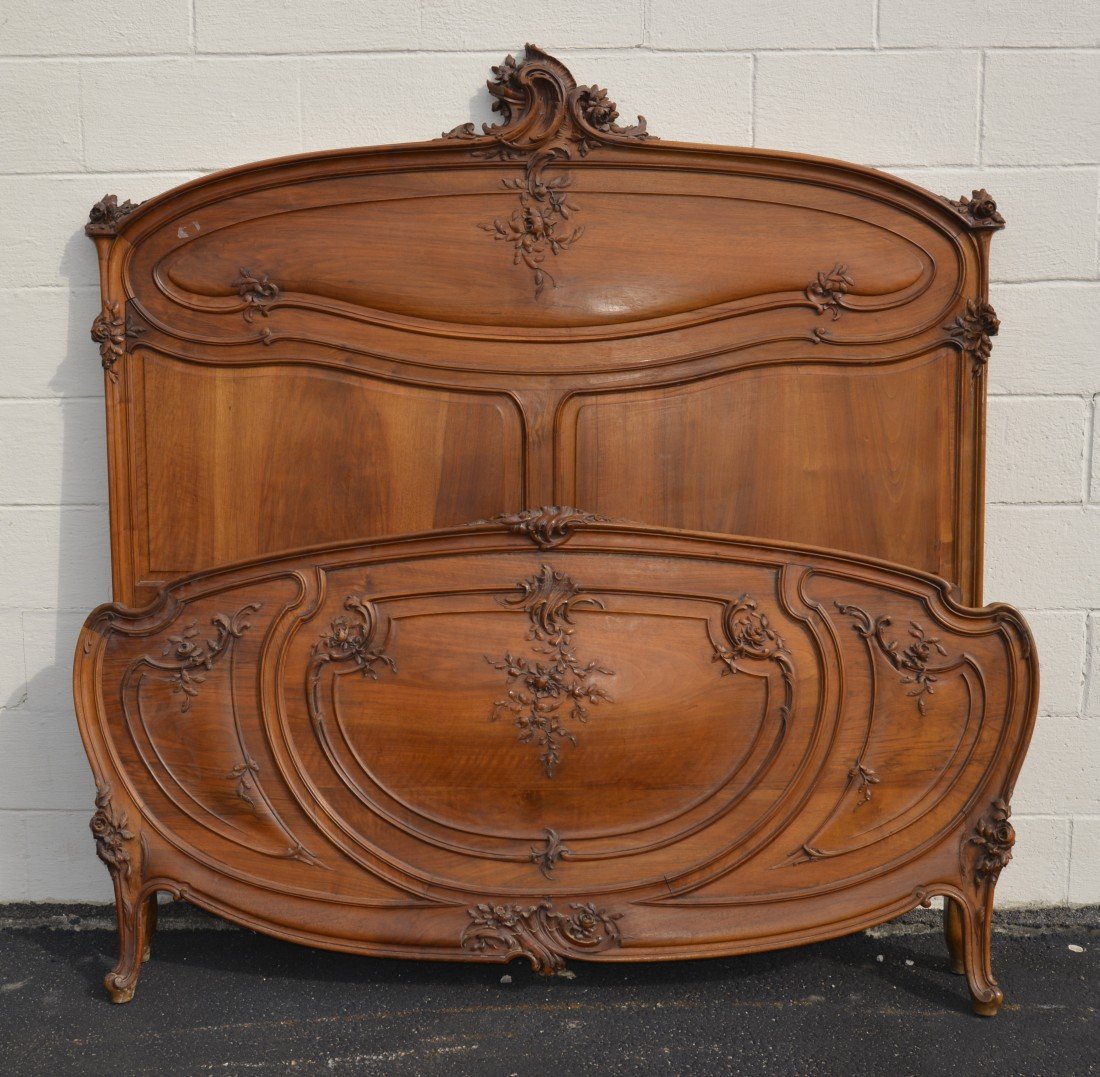 ART NOUVEAU CARVED FRUITWOOD QUEEN SIZE BED;: ART NOUVEAU CARVED FRUITWOOD QUEEN SIZE BED; height: 67 in., width: 62 in. Other Notes: This bed compliments lot 140, an Armoire. In the manner of Majorelle.