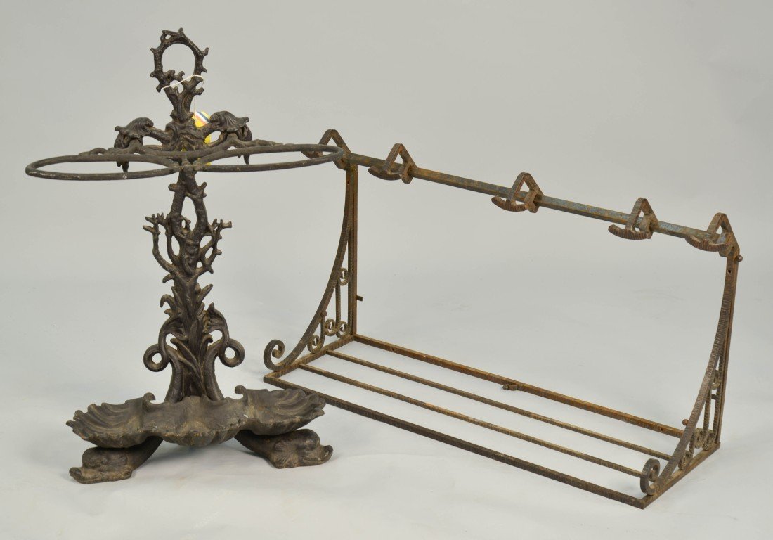 CAST IRON UMBRELLA STAND AND METAL SHELF RACK;: CAST IRON UMBRELLA STAND AND METAL SHELF RACK; height of umbrella stand: 30 in.; length of rack: 33 in.