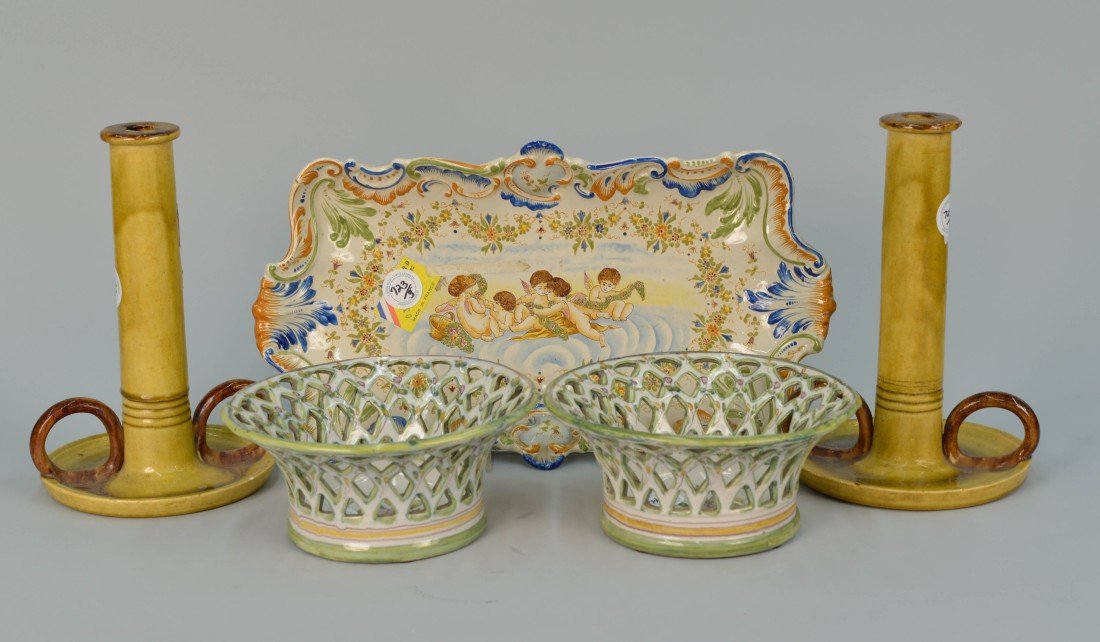 PAIR OF FRENCH FAEINCE BASKETS, TRAY AND CANDLESTAND;: PAIR OF FRENCH FAEINCE RETICULATED BASKETS, A PUTTI DECORATED FAIENCE TRAY AND A YELLOW GLAZED CANDLESTAND; diameter of basket: 8 3/4 in; length of tray: 17 1/2 in.