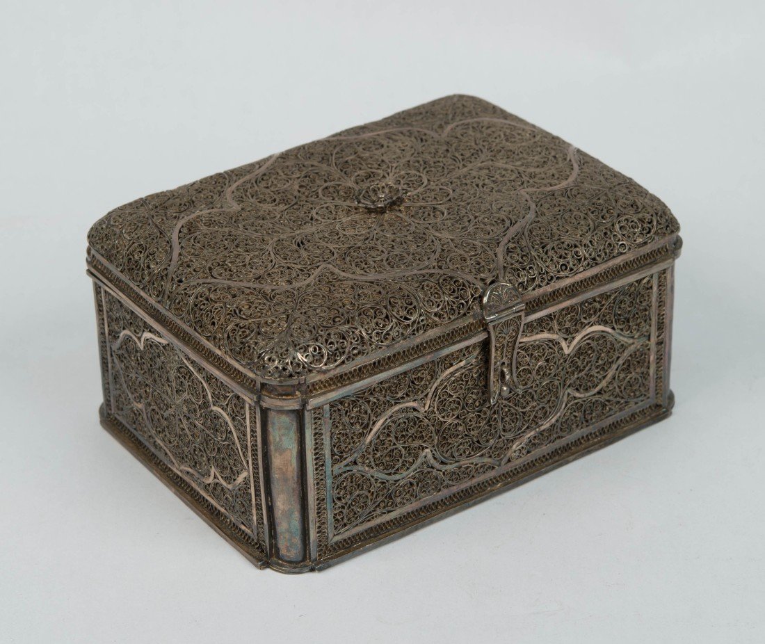SILVER OR SILVERED METAL FILIGREE JEWELRY BOX;: SILVER OR SILVERED METAL FILIGREE JEWELRY BOX; bearing engraved royal coats of arms on base, purportedly from The Queen Adelaide, Consort of William IV, Collection of the Duke of Cambridge ; length: 7