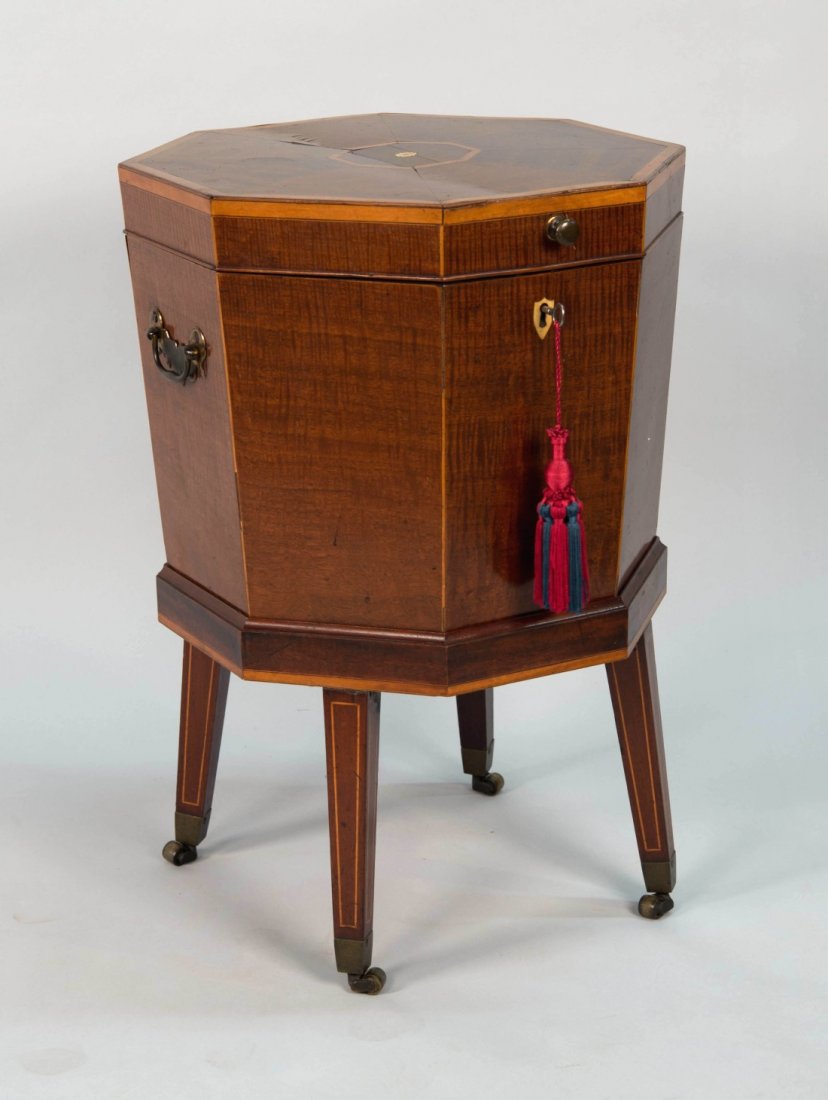 GEORGE III MAHOGANY INLAID OCTAGONAL CELLARETTE ON: GEORGE III MAHOGANY INLAID OCTAGONAL CELLARETTE ON STAND, circa 1800; with brass handles; height: 26 1/2 in.; diameter: 17 3/4 in.