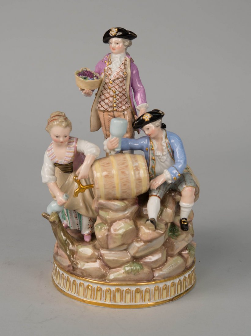MEISSEN PORCELAIN FIGURAL GROUP, circa 1900;: MEISSEN PORCELAIN FIGURAL GROUP, circa 1900; depicting three figures and a wine barrel; bearing crossed swords mark in underglaze blue and incised numerals 163,83....; height: 8 1/4 in.