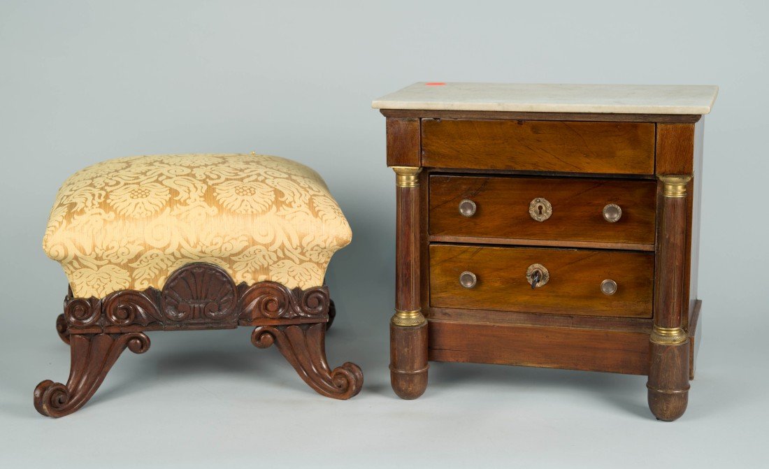 MINIATURE EMPIRE STYLE MAHOGANY GILT BRONZE MARBLE TOP: MINIATURE EMPIRE STYLE MAHOGANY GILT BRONZE MARBLE TOP CHEST OF DRAWERS; height: 13 1/2; width: 14 in.; depth: 8 1/4 in.; together with a CONTINENTAL CARVED MAHOGANY FOOTSTOOL