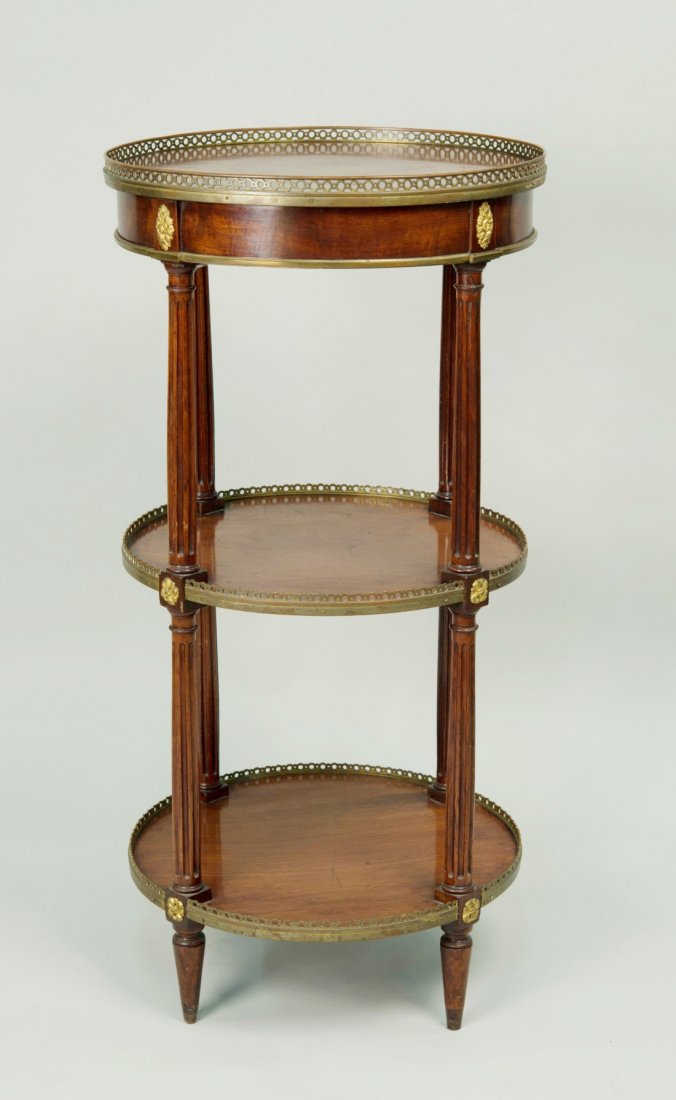 ENGLISH OR CONTINENTAL MAHOGANY GILT BRONZE MOUNTED: ENGLISH OR CONTINENTAL MAHOGANY GILT BRONZE MOUNTED THREE TIER GUERIDON, 18th century; height: 39 in.; diameter: 19 in. Provenance: Property of a Newport, Rhode Island Family.