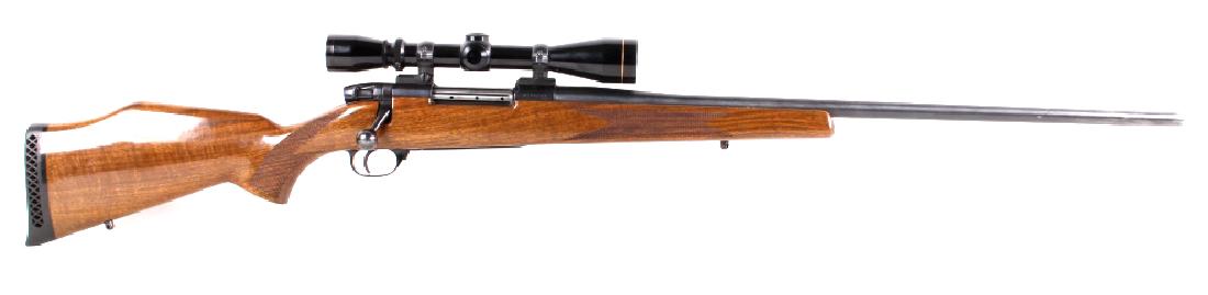 Weatherby Mark V .300 WBY Magnum Rifle & Scope: This lot features a 1972-94 Weatherby Mark V in Weatherby .300 Weatherby Magnum and a Leopold 3x9 Vari-X II scope. This rifle features a walnut monte carlo straight grain stock, a factory recoil pad, 