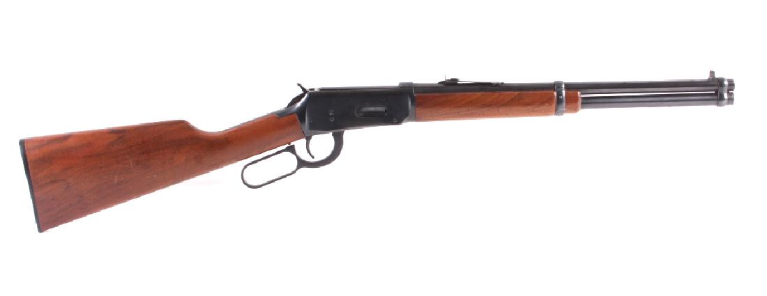 Winchester Model 94 .30-30 Lever Action Carbine: This is a Winchester Model 94 lever action carbine rifle chambered in the .30-30 caliber manufactured in 1980. The rifle features a blued steel barrel and receiver with solid walnut hardwood stocks an