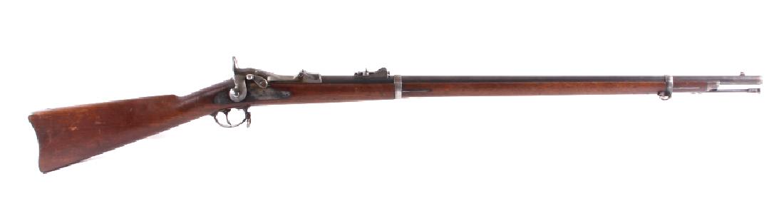 U.S. Springfield Model 1873 .45-70 Trapdoor Rifle: This is a U.S. Springfield Model 1873 Trapdoor rifle chambered in the .45-70 and manufactured in 1881. The rifle features a solid walnut hardwood stock and is nicknamed the "Trapdoor" for the way in w